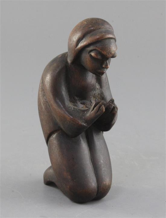 An African carved hardwood figure of a praying woman, 17cm